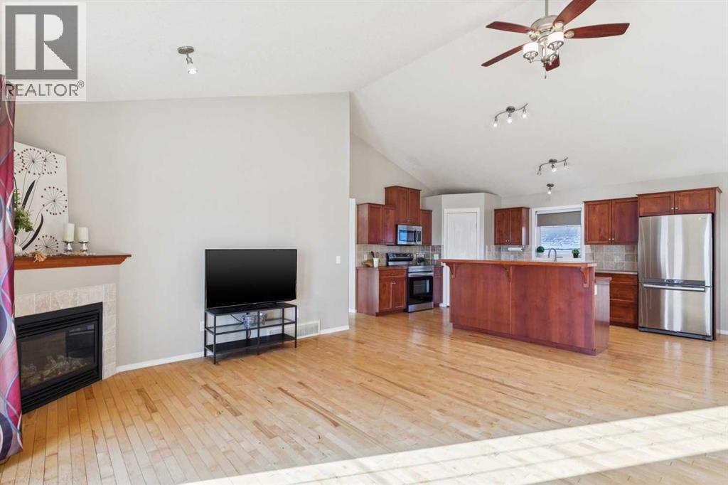 100B Westview Drive, Nanton, AB - Indoor With Fireplace