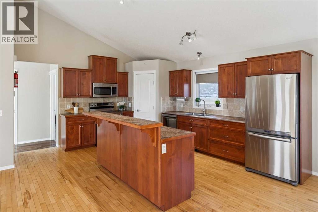 100B Westview Drive, Nanton, AB - Indoor Photo Showing Kitchen With Stainless Steel Kitchen With Double Sink