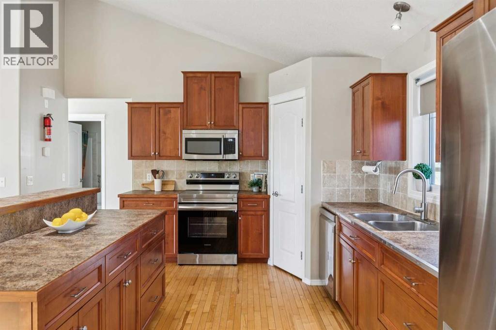 100B Westview Drive, Nanton, AB - Indoor Photo Showing Kitchen With Stainless Steel Kitchen With Double Sink