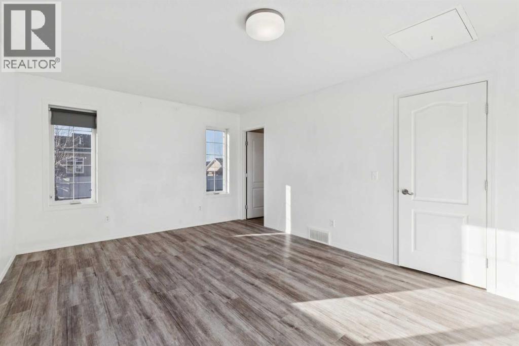 Primary Suite - Main Floor - 100B Westview Drive, Nanton, AB - Indoor Photo Showing Other Room