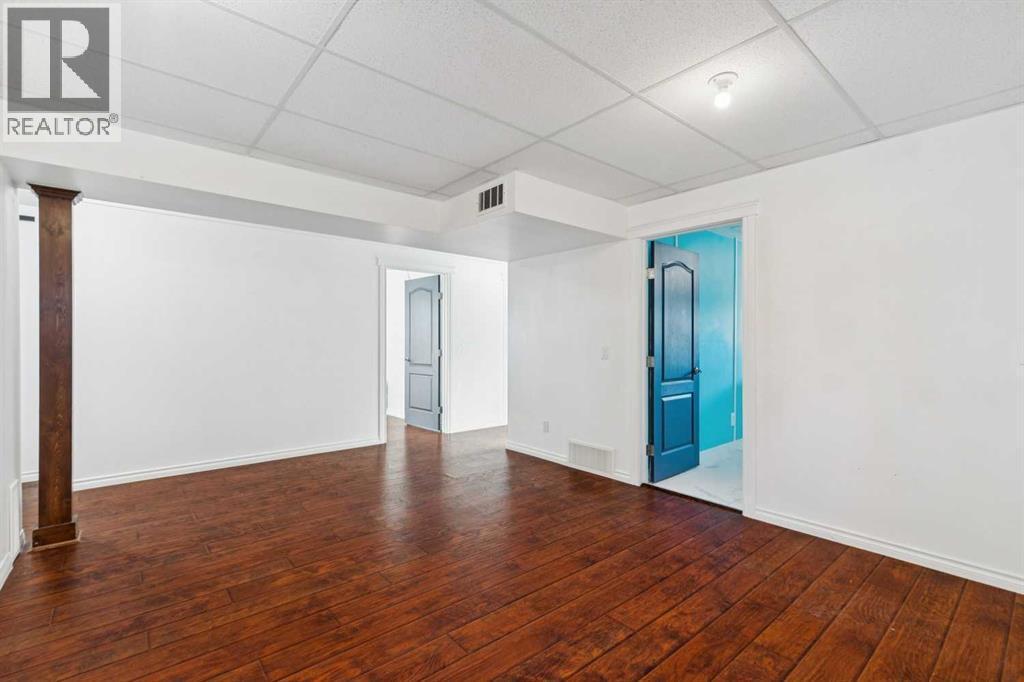 Family room - 100B Westview Drive, Nanton, AB - Indoor Photo Showing Other Room