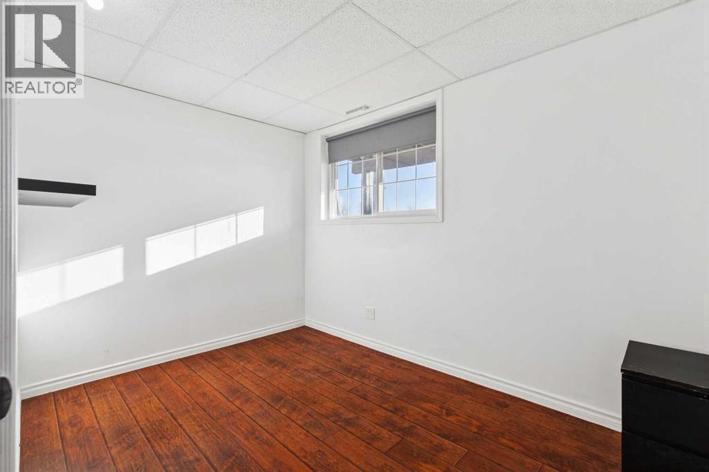 second bedroom - Lower level - 100B Westview Drive, Nanton, AB - Indoor Photo Showing Other Room