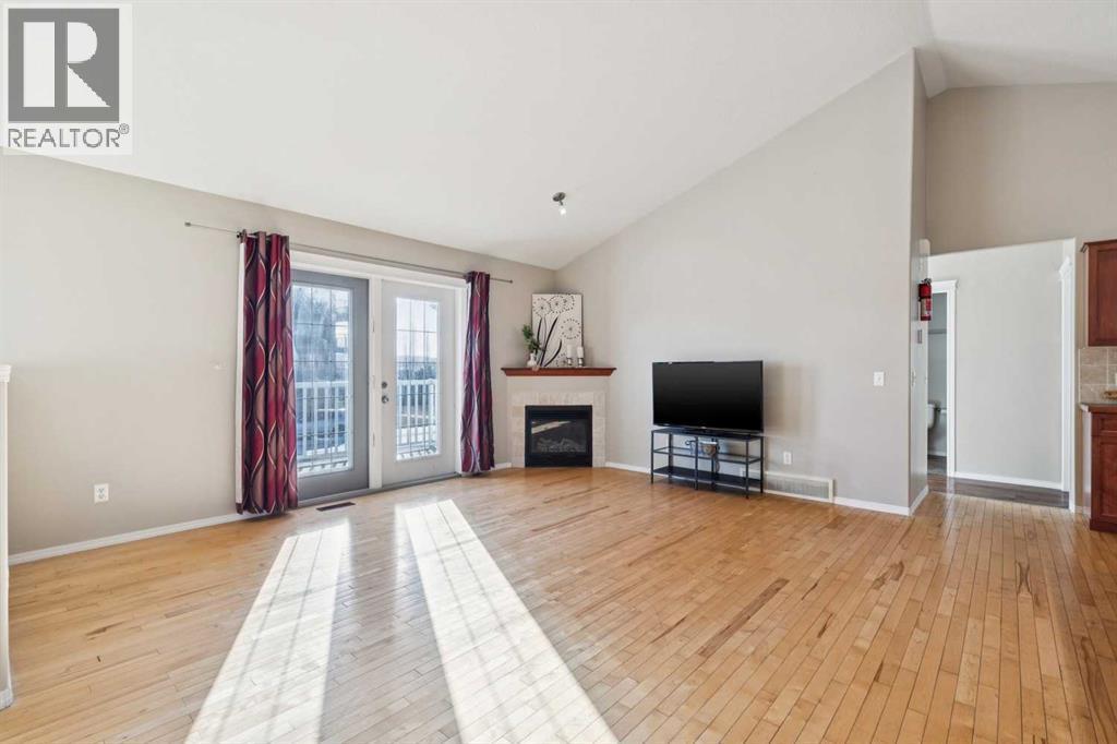 100B Westview Drive, Nanton, AB - Indoor Photo Showing Living Room With Fireplace
