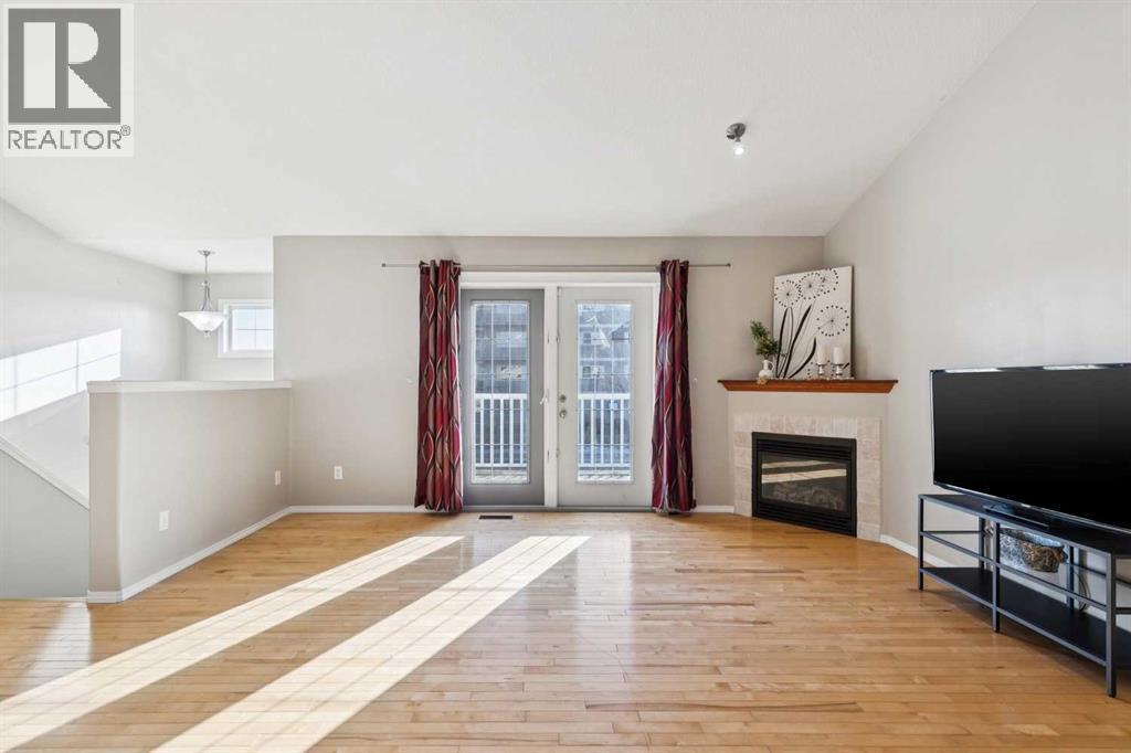 100B Westview Drive, Nanton, AB - Indoor With Fireplace