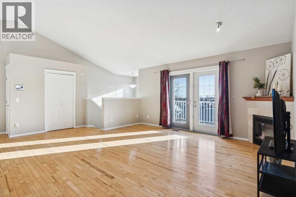 100B Westview Drive, Nanton, AB - Indoor With Fireplace