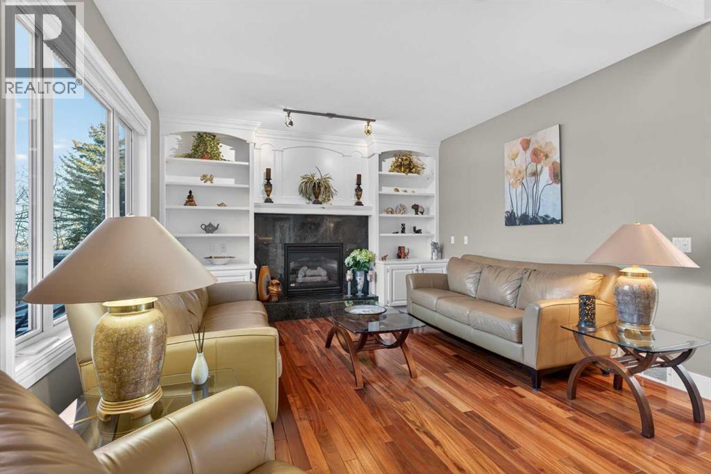 14 Christie Estate Terrace Sw, Calgary, AB - Indoor Photo Showing Living Room With Fireplace