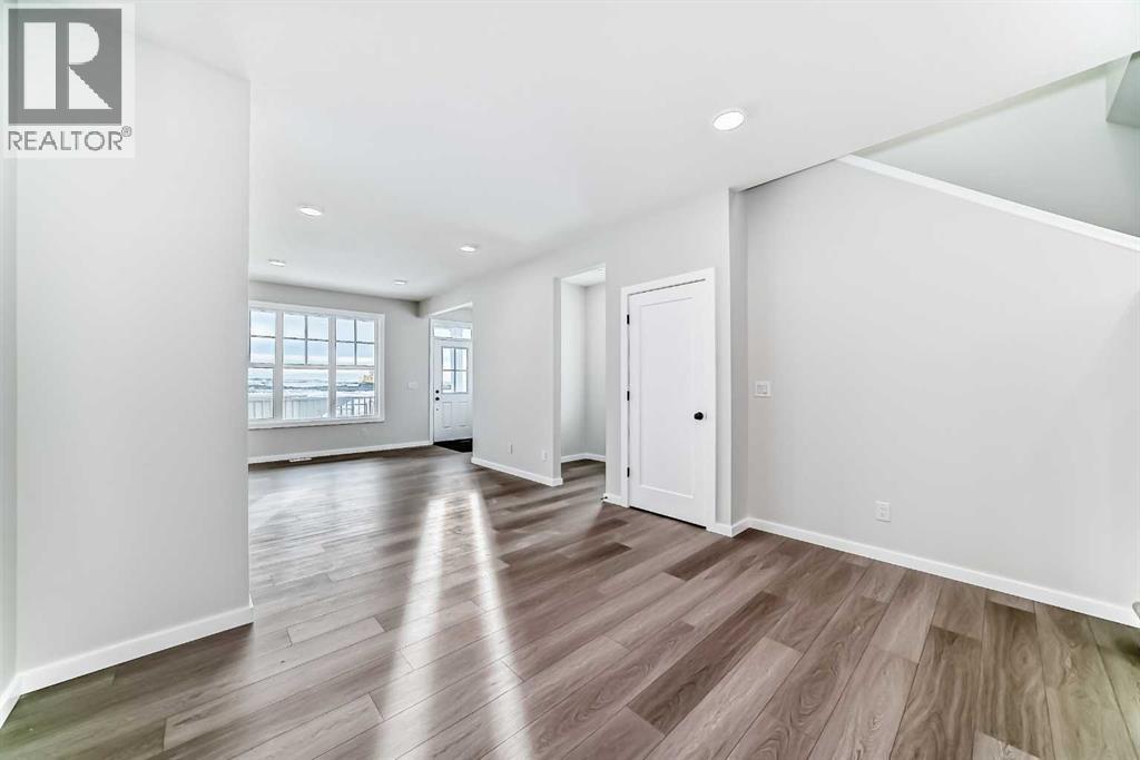 PLEASE NOTE: Photos are of a DIFFERENT Spec Home of the same model – fit and finish may differ. Interior selections and floorplans shown in photos - 158 Bartlett Crescent Se, Calgary, AB - Indoor Photo Showing Other Room