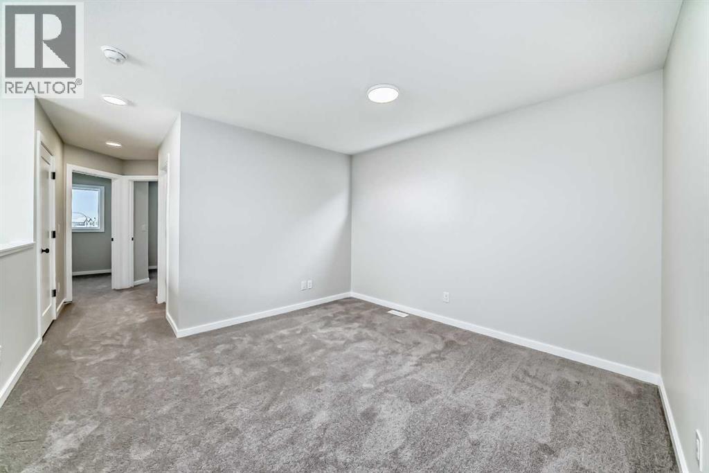 PLEASE NOTE: Photos are of a DIFFERENT Spec Home of the same model – fit and finish may differ. Interior selections and floorplans shown in photos - 158 Bartlett Crescent Se, Calgary, AB - Indoor Photo Showing Other Room