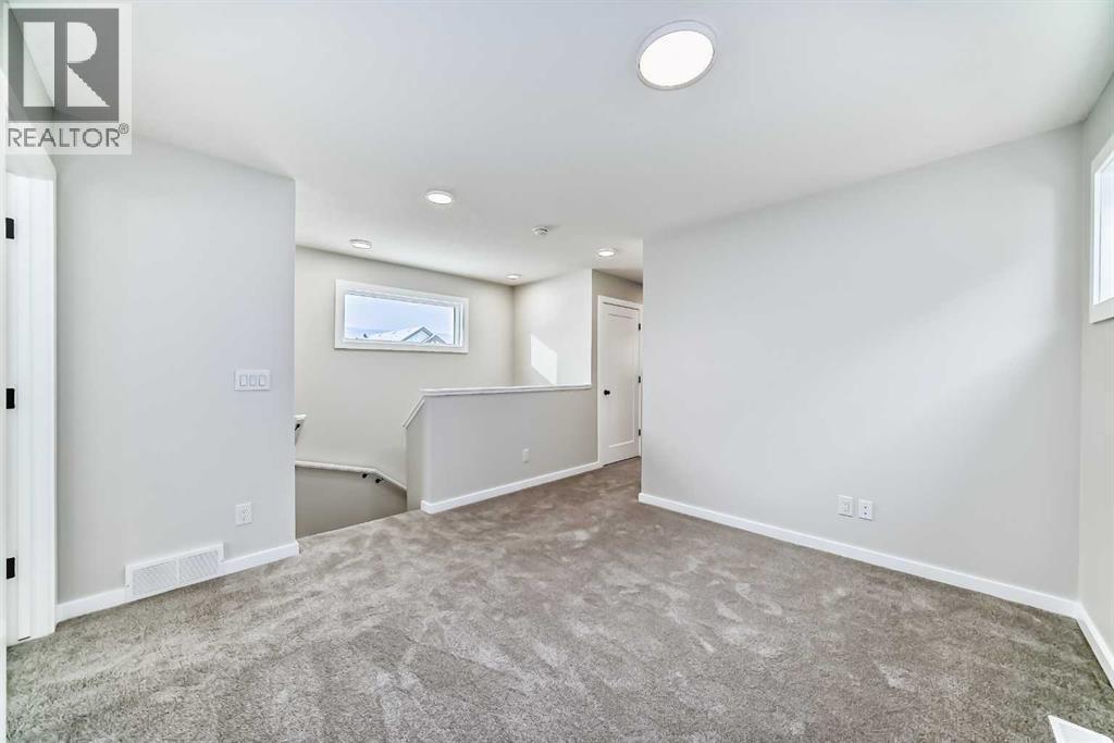 PLEASE NOTE: Photos are of a DIFFERENT Spec Home of the same model – fit and finish may differ. Interior selections and floorplans shown in photos - 158 Bartlett Crescent Se, Calgary, AB - Indoor Photo Showing Other Room