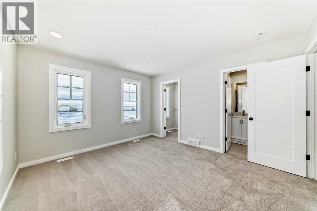 PLEASE NOTE: Photos are of a DIFFERENT Spec Home of the same model – fit and finish may differ. Interior selections and floorplans shown in photos - 158 Bartlett Crescent Se, Calgary, AB - Indoor Photo Showing Other Room