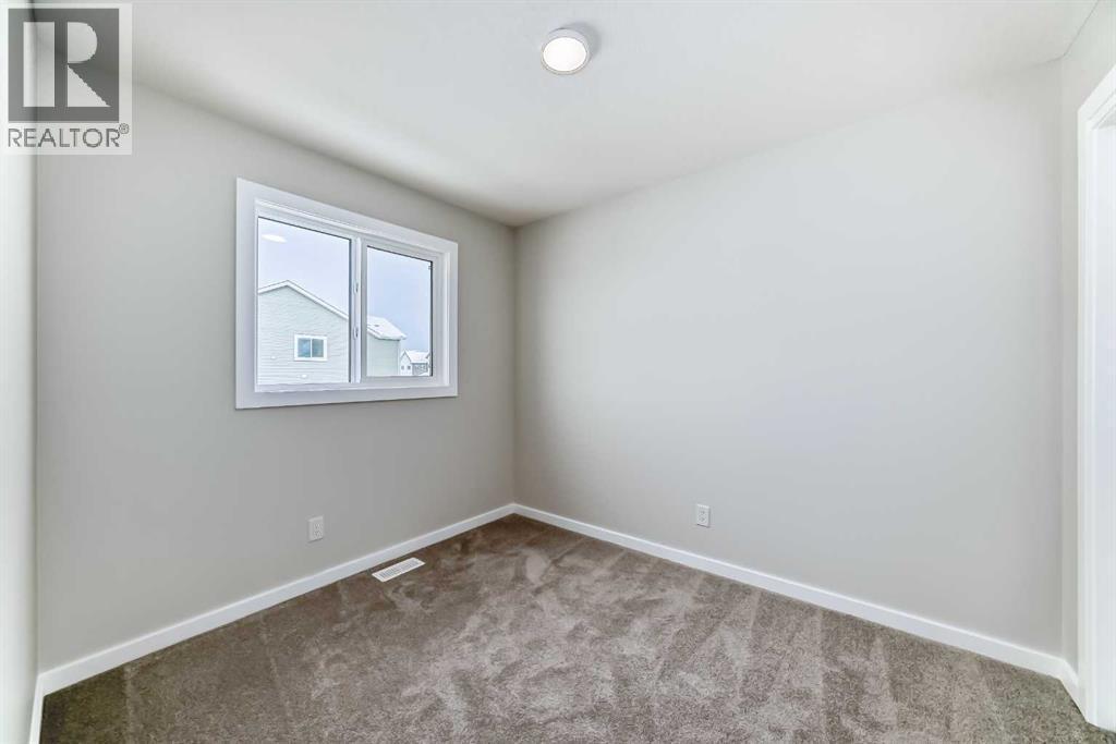 PLEASE NOTE: Photos are of a DIFFERENT Spec Home of the same model – fit and finish may differ. Interior selections and floorplans shown in photos - 158 Bartlett Crescent Se, Calgary, AB - Indoor Photo Showing Other Room