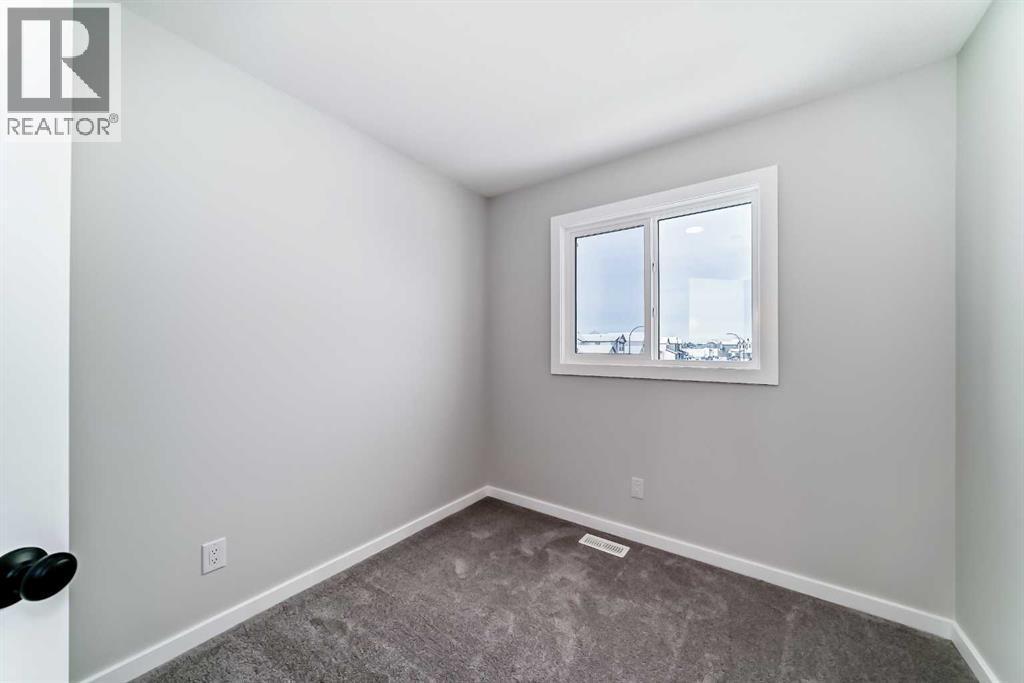 PLEASE NOTE: Photos are of a DIFFERENT Spec Home of the same model – fit and finish may differ. Interior selections and floorplans shown in photos - 158 Bartlett Crescent Se, Calgary, AB - Indoor Photo Showing Other Room