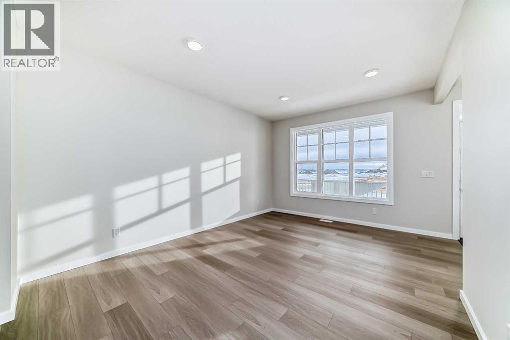 PLEASE NOTE: Photos are of a DIFFERENT Spec Home of the same model – fit and finish may differ. Interior selections and floorplans shown in photos - 158 Bartlett Crescent Se, Calgary, AB - Indoor Photo Showing Other Room