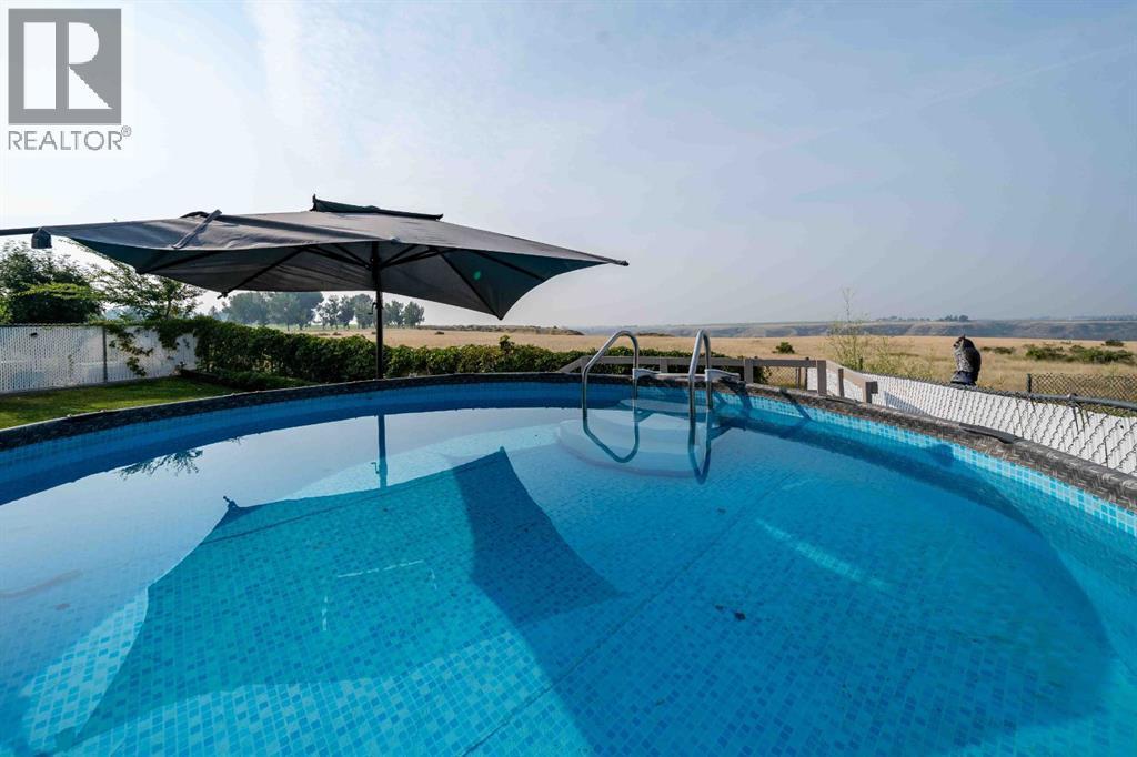 110 Redcliff Way Sw, Redcliff, AB - Outdoor With In Ground Pool With Backyard