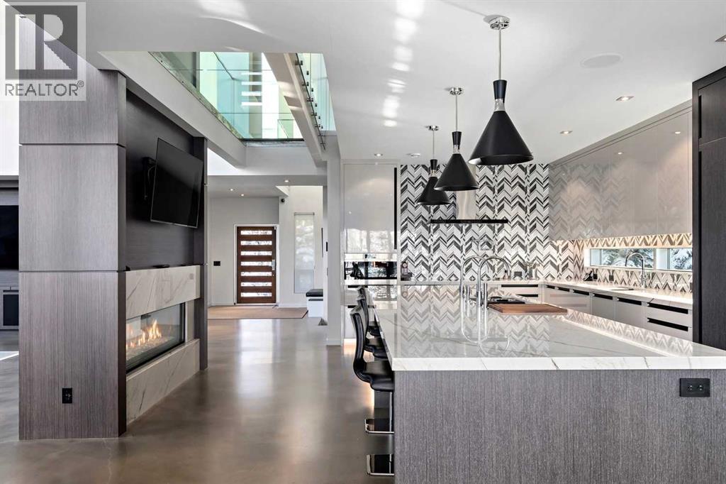 25 Posthill Drive Sw, Calgary, AB - Indoor Photo Showing Kitchen With Fireplace With Upgraded Kitchen