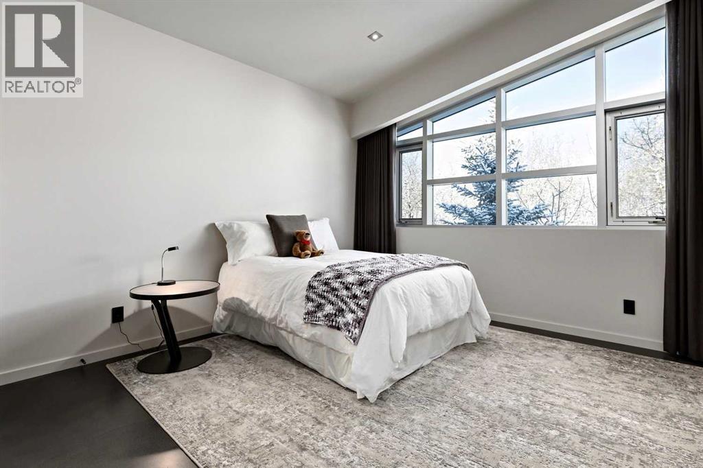 25 Posthill Drive Sw, Calgary, AB - Indoor Photo Showing Bedroom