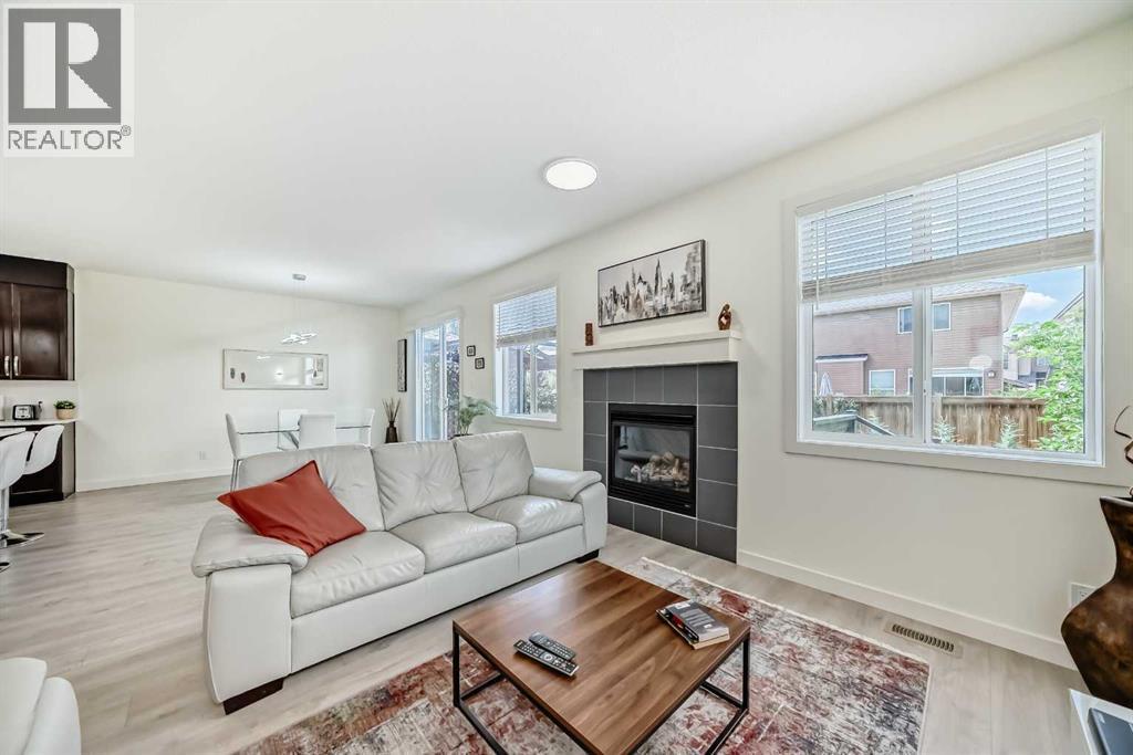 437 Auburn Bay Drive Se, Calgary, AB - Indoor Photo Showing Living Room With Fireplace