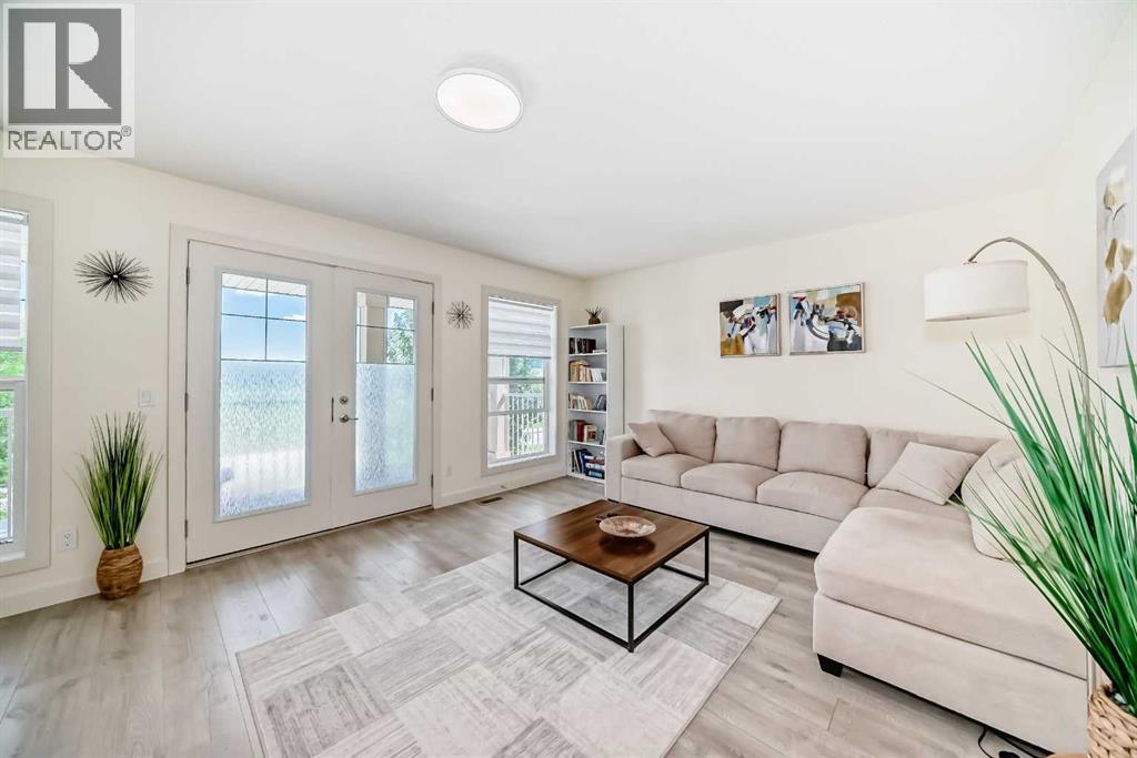 437 Auburn Bay Drive Se, Calgary, AB - Indoor Photo Showing Living Room