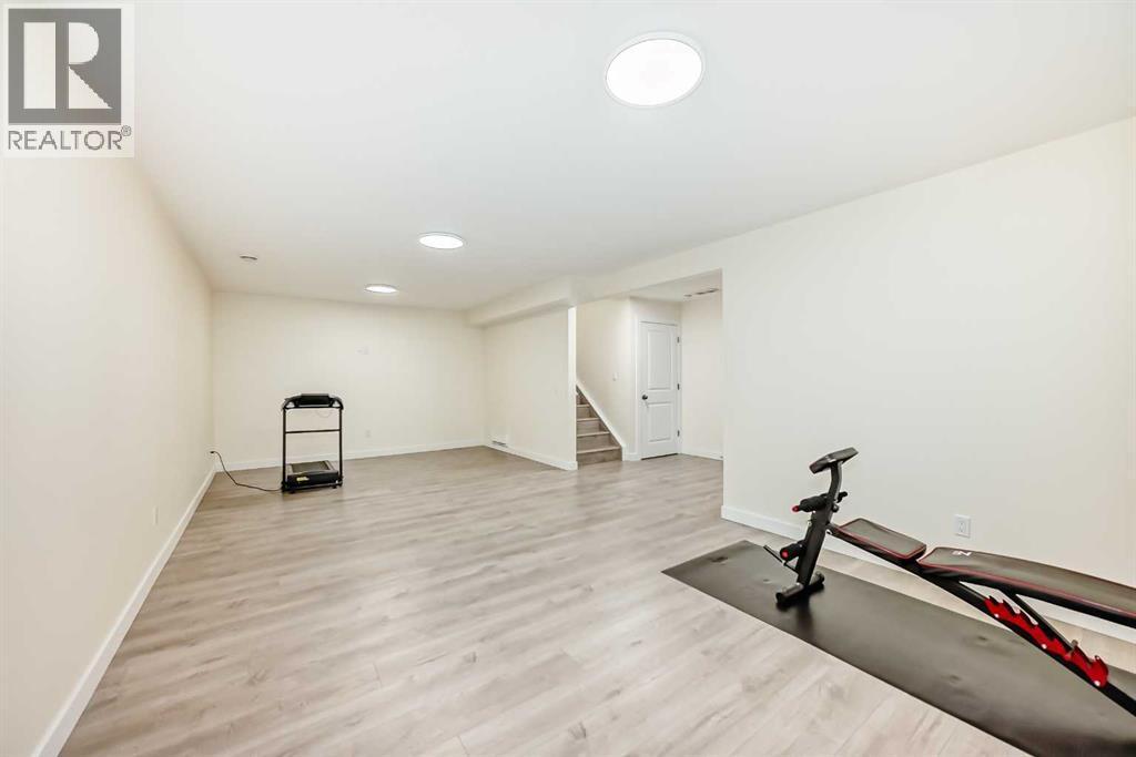 437 Auburn Bay Drive Se, Calgary, AB - Indoor Photo Showing Gym Room