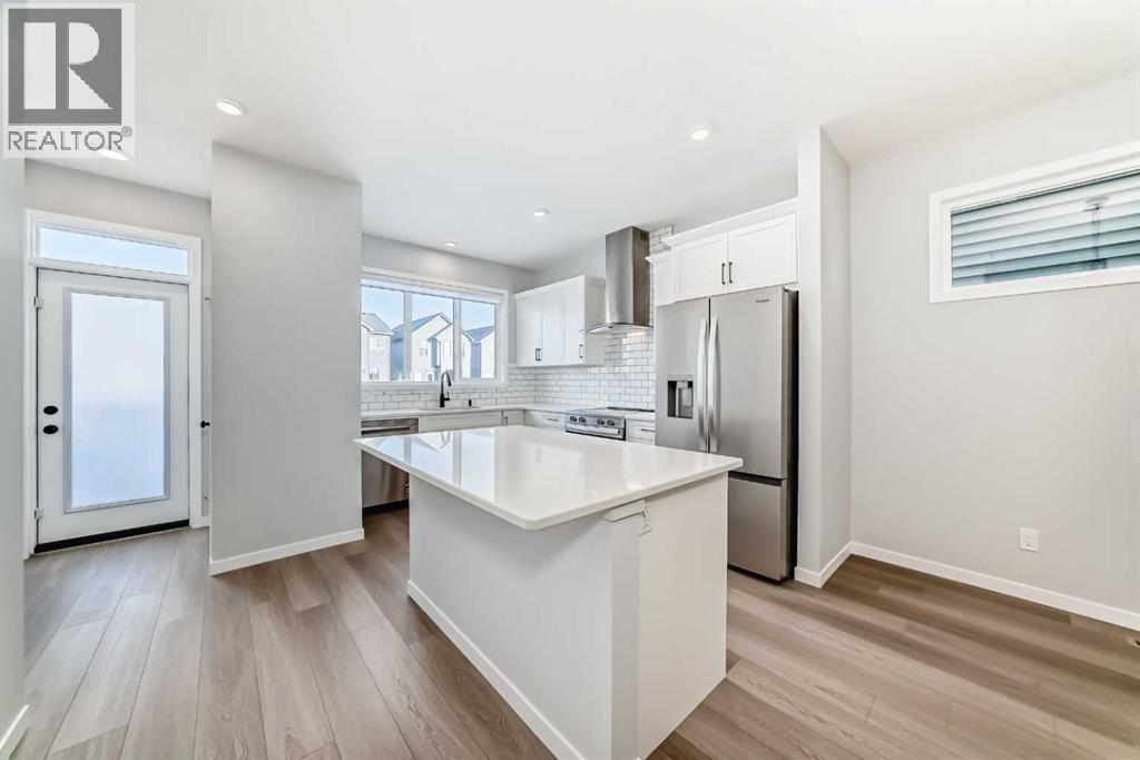 32 Creekview Common Sw, Calgary, AB - Indoor Photo Showing Kitchen With Stainless Steel Kitchen With Upgraded Kitchen