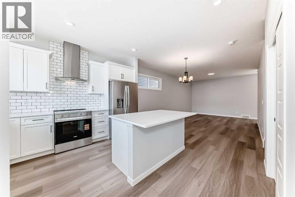 32 Creekview Common Sw, Calgary, AB - Indoor Photo Showing Kitchen With Upgraded Kitchen