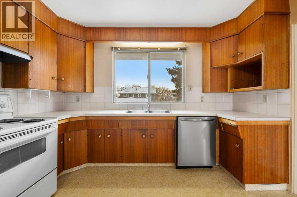 2719 Chalice Road Nw, Calgary, AB - Indoor Photo Showing Kitchen With Double Sink