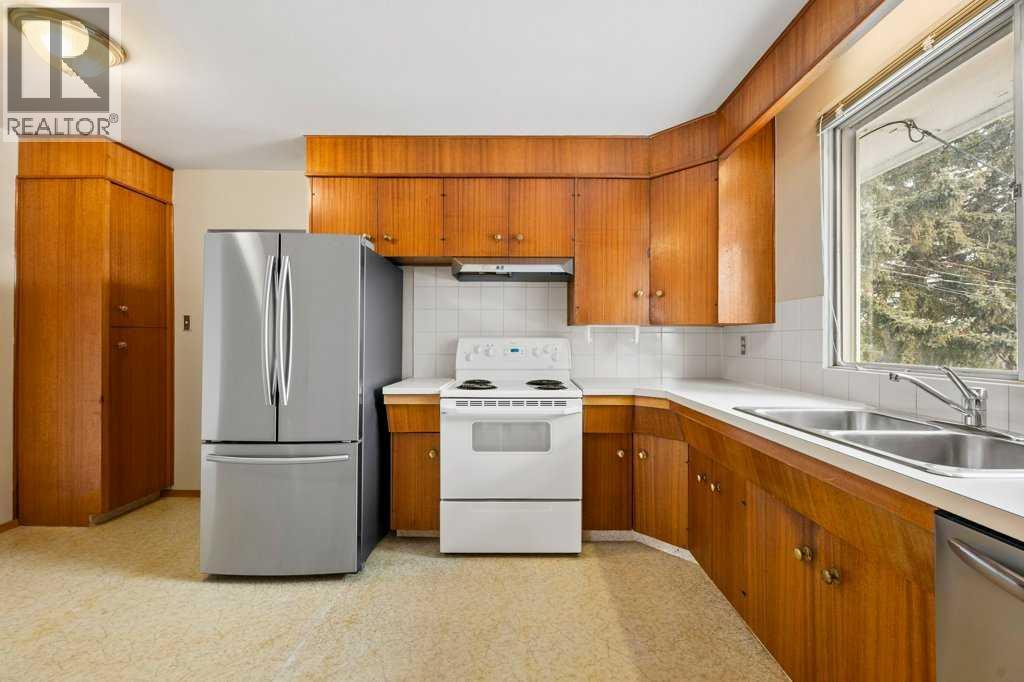 2719 Chalice Road Nw, Calgary, AB - Indoor Photo Showing Kitchen With Double Sink