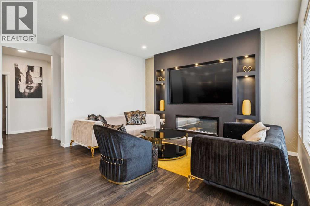 86 Creekside Way Sw, Calgary, AB - Indoor Photo Showing Other Room With Fireplace