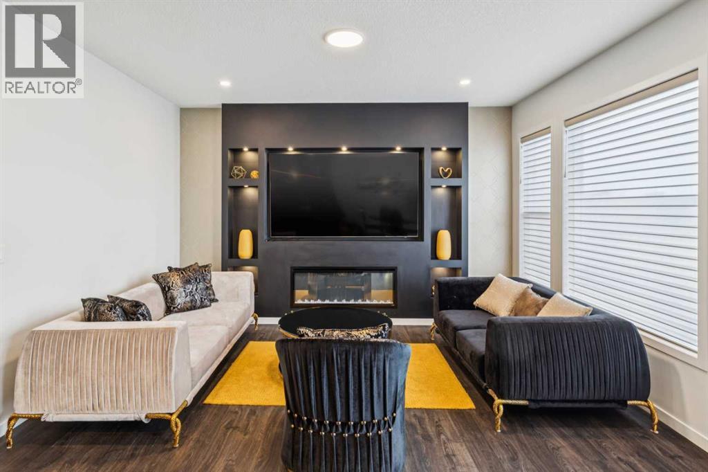 86 Creekside Way Sw, Calgary, AB - Indoor Photo Showing Living Room With Fireplace
