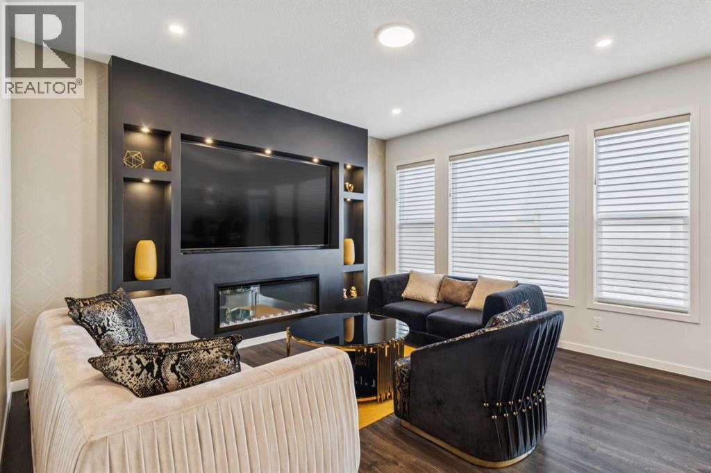 86 Creekside Way Sw, Calgary, AB - Indoor Photo Showing Living Room With Fireplace