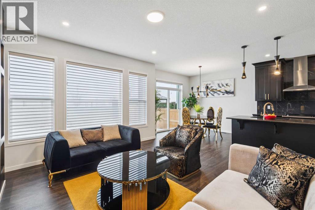 86 Creekside Way Sw, Calgary, AB - Indoor Photo Showing Living Room