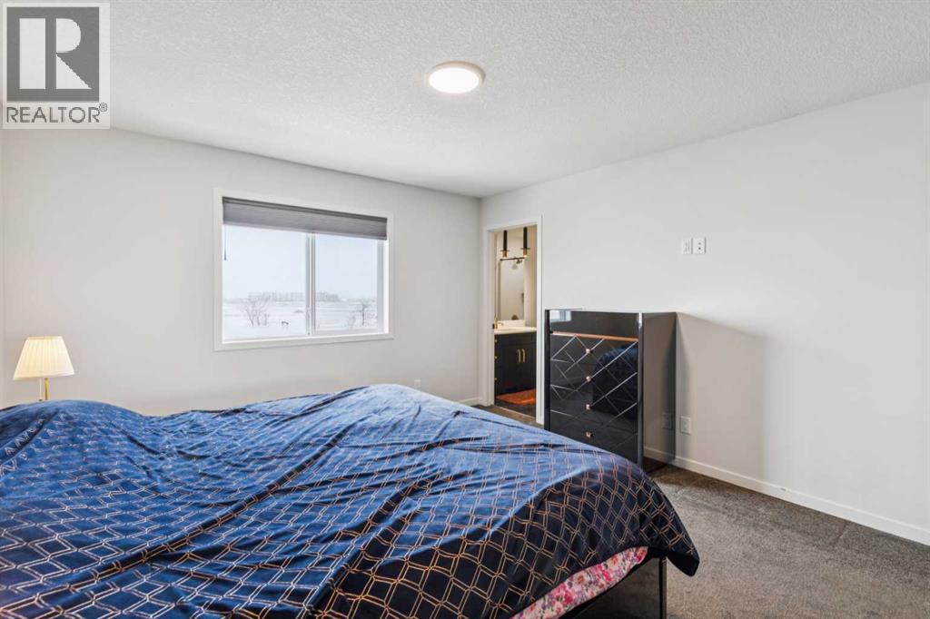 86 Creekside Way Sw, Calgary, AB - Indoor Photo Showing Bedroom