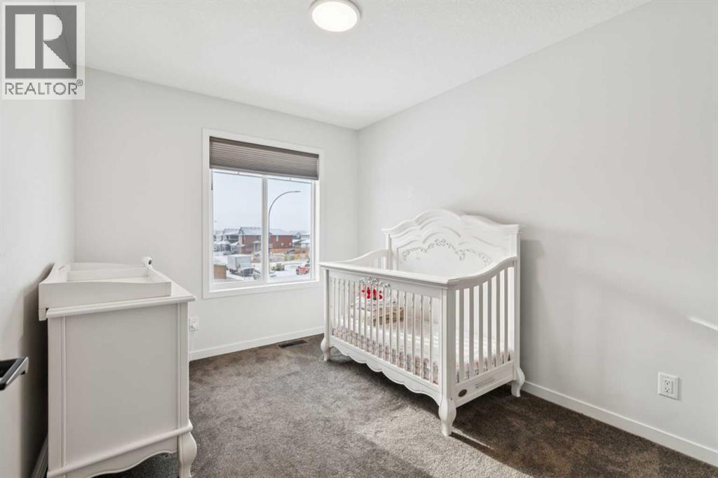 86 Creekside Way Sw, Calgary, AB - Indoor Photo Showing Bedroom