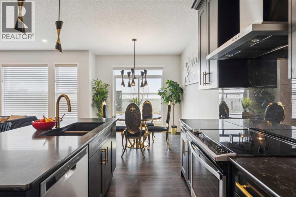 86 Creekside Way Sw, Calgary, AB - Indoor Photo Showing Kitchen With Stainless Steel Kitchen With Double Sink With Upgraded Kitchen