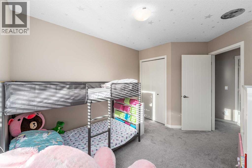 Bedroom 3 - 17 Evansridge Circle Nw, Calgary, AB - Indoor Photo Showing Bedroom