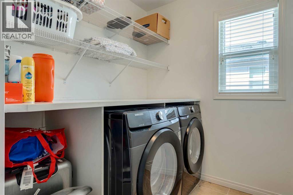 123 Marquis Green Se, Calgary, AB - Indoor Photo Showing Laundry Room