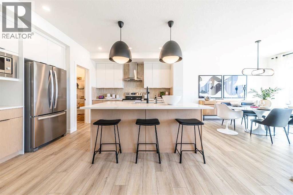 211 Langwell Common Se, Airdrie, AB - Indoor Photo Showing Kitchen With Stainless Steel Kitchen With Upgraded Kitchen
