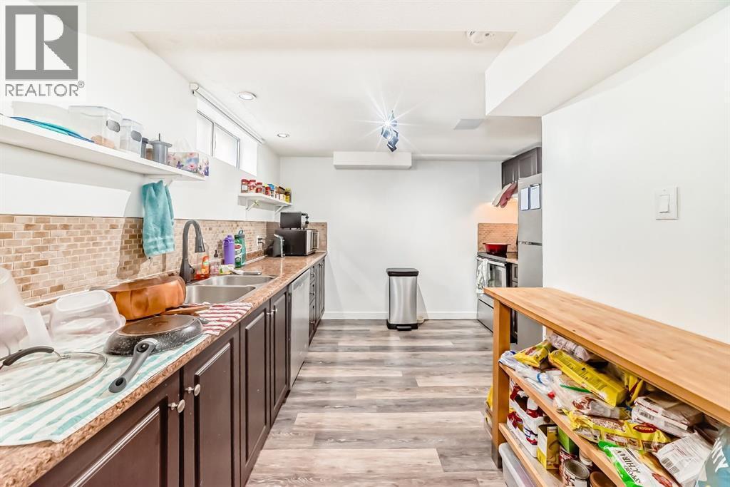 176 Hendon Drive Nw, Calgary, AB - Indoor Photo Showing Kitchen With Double Sink
