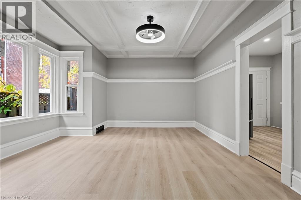 Additional living space with light wood-style floors and beamed ceiling - 88 Gage Avenue S, Hamilton, ON - Indoor Photo Showing Other Room