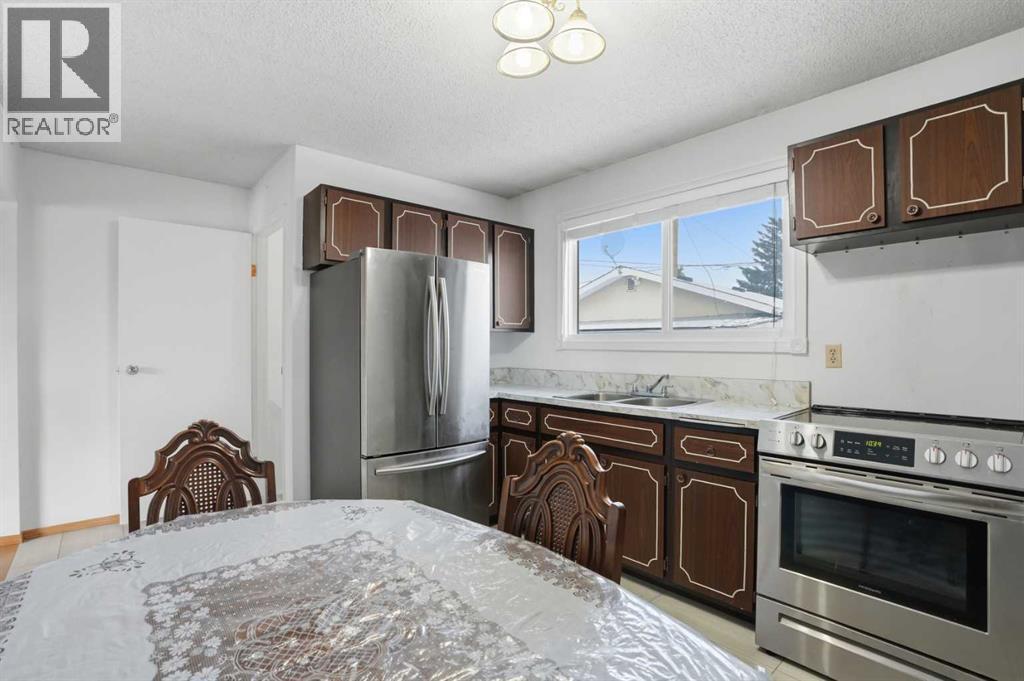 5224 5 Avenue Se, Calgary, AB - Indoor Photo Showing Kitchen With Stainless Steel Kitchen With Double Sink