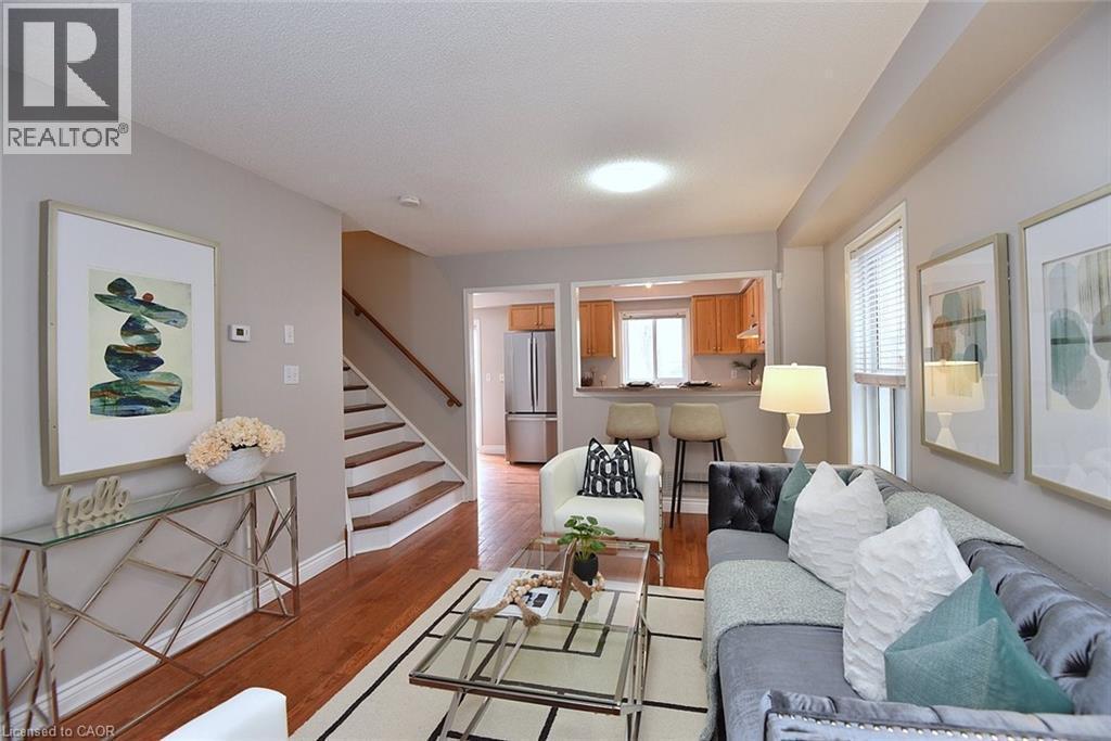 Living room with light wood-style floors and stairs - 2258 Empire Crescent, Burlington, ON - Indoor Photo Showing Living Room