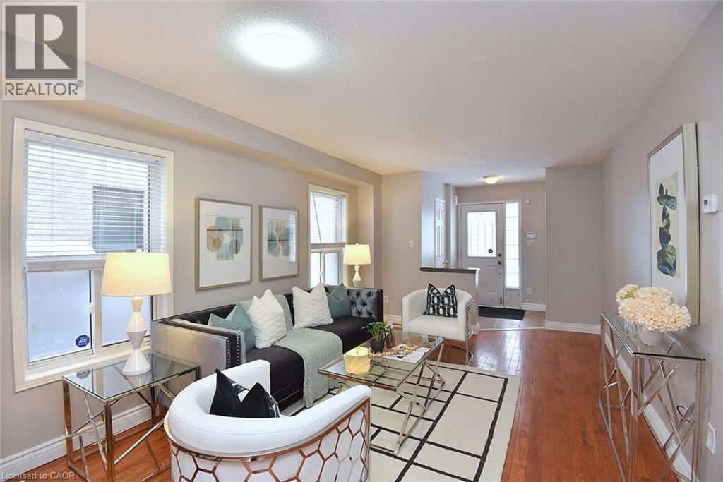 Living area with hardwood / wood-style floors and a textured ceiling - 2258 Empire Crescent, Burlington, ON - Indoor Photo Showing Living Room