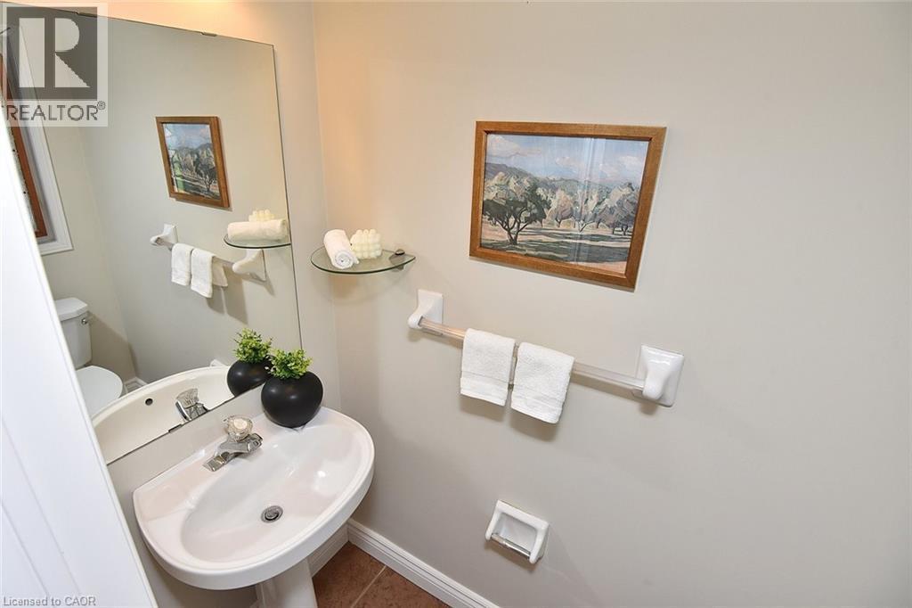 Bathroom featuring a sink and tile patterned flooring - 2258 Empire Crescent, Burlington, ON - Indoor Photo Showing Bathroom