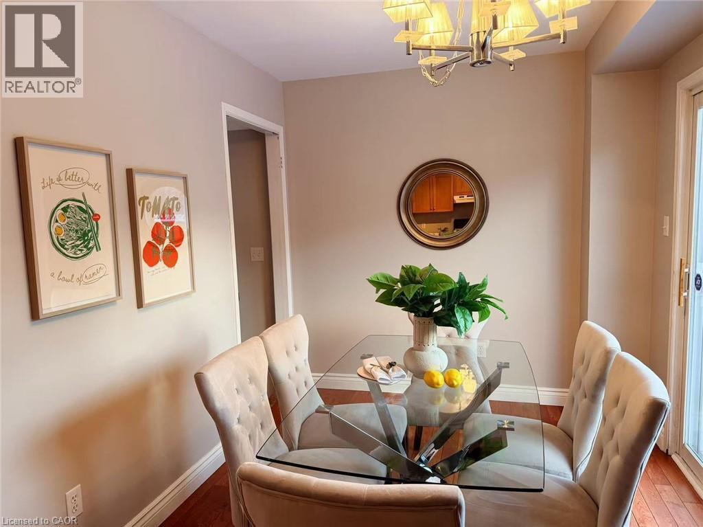 Dining room with a chandelier and hardwood / wood-style flooring - 2258 Empire Crescent, Burlington, ON - Indoor Photo Showing Dining Room