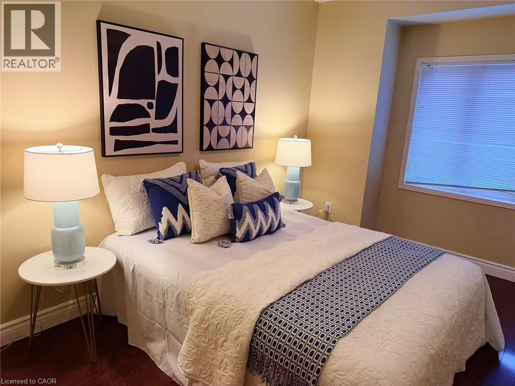 Bedroom with dark wood-style flooring - 2258 Empire Crescent, Burlington, ON - Indoor Photo Showing Bedroom