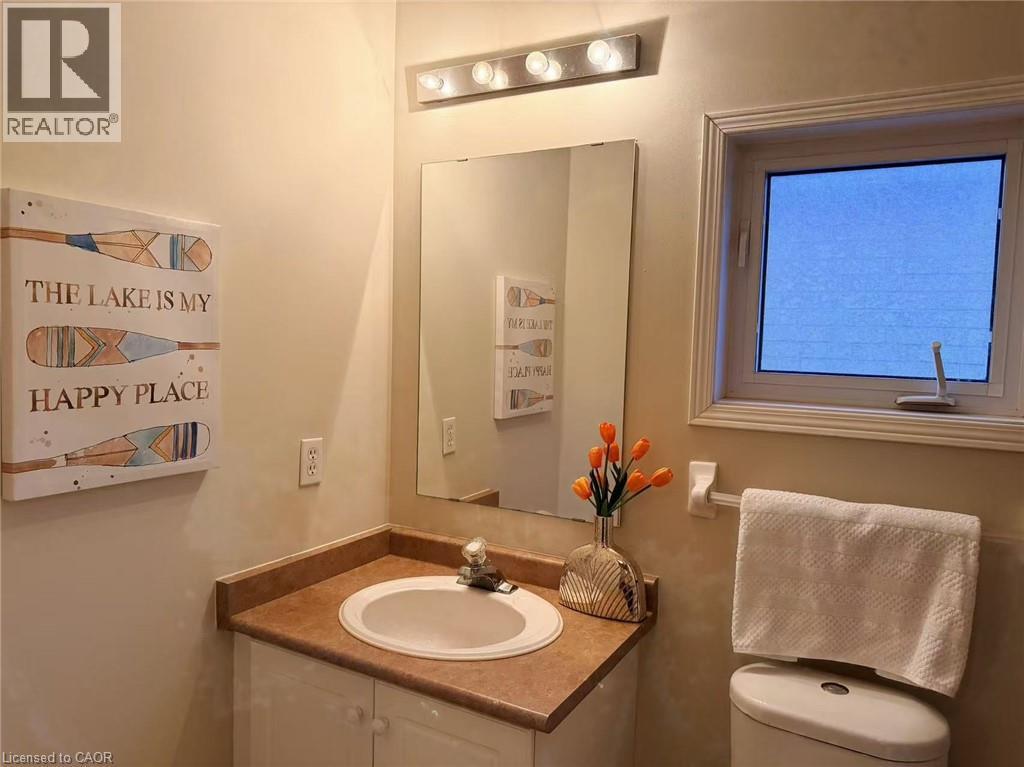 Half bath with vanity and toilet - 2258 Empire Crescent, Burlington, ON - Indoor Photo Showing Bathroom