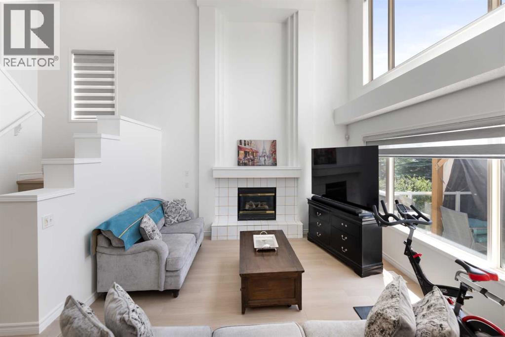 Living Room - 7 Country Hills Park Nw, Calgary, AB - Indoor Photo Showing Living Room With Fireplace