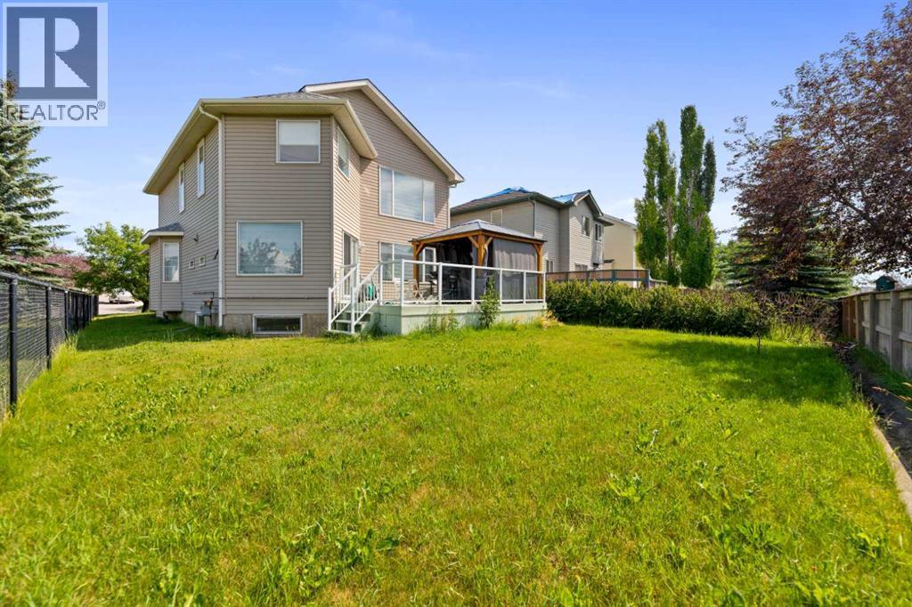 Backyard - 7 Country Hills Park Nw, Calgary, AB - Outdoor With Deck Patio Veranda