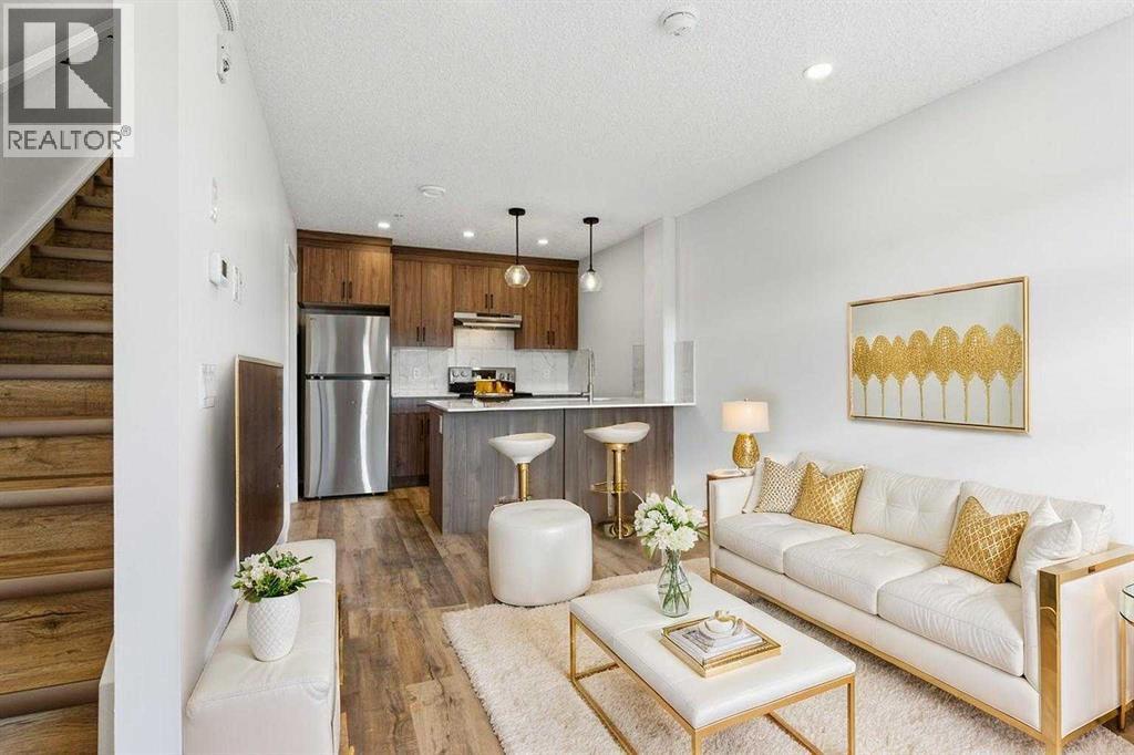 102, 156 Park Street, Cochrane, AB - Indoor Photo Showing Living Room