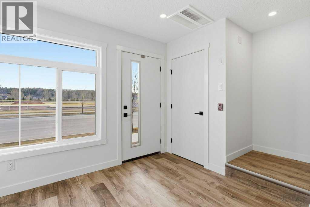 102, 156 Park Street, Cochrane, AB - Indoor Photo Showing Other Room